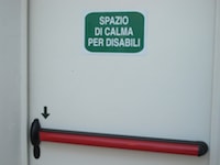 Fig. 5. Icon for “Area of refuge” used on a access door. The writing :Spazio di calma for persons with disabilities, remarks how big is the work still to develop, even in terms of diffused knowledge.